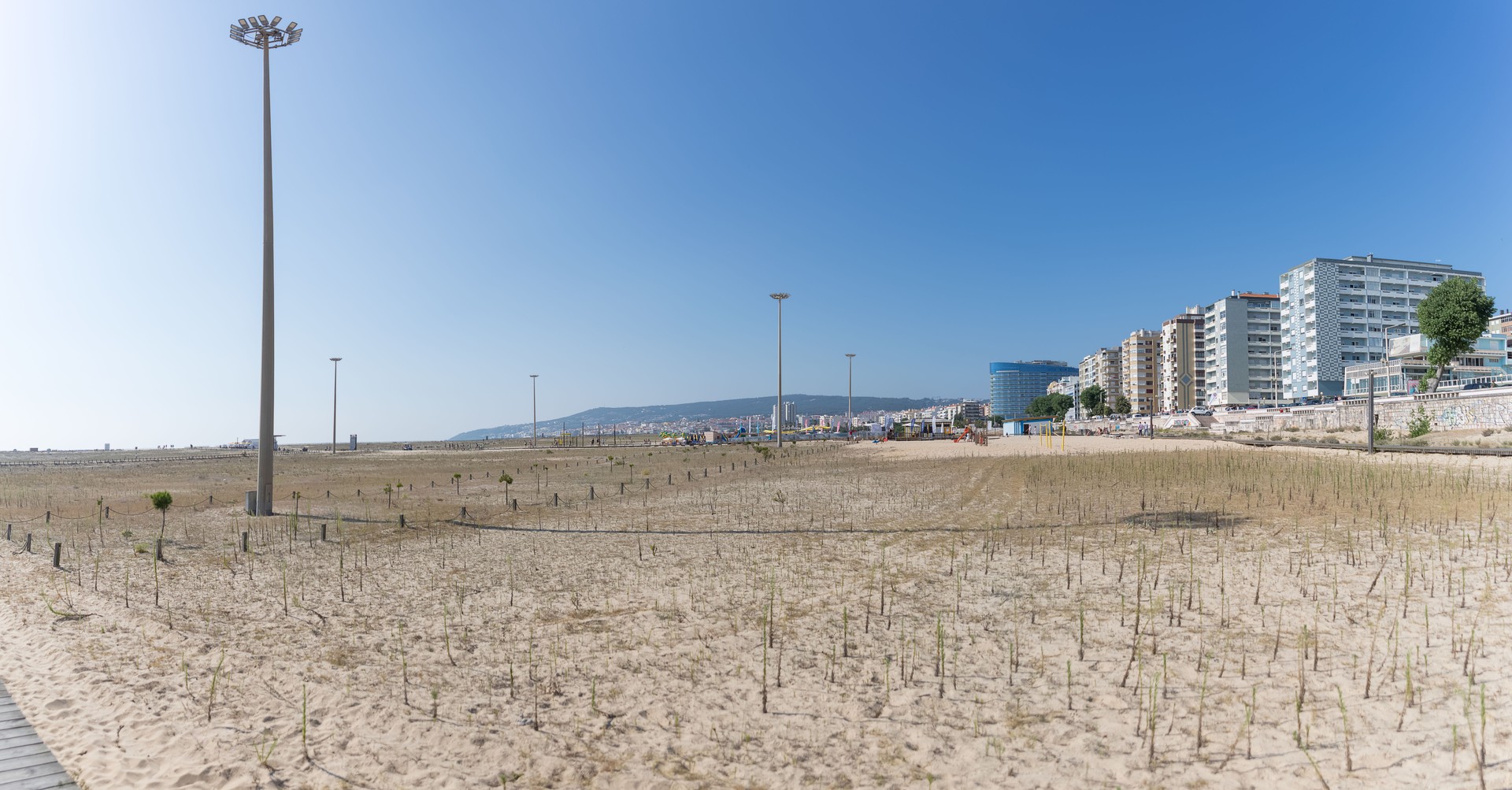Amazing panoramic view of Figueira da Foz, Claridade beach with pedestrian walkways and main Brazil avenue, along the seafront with buildings